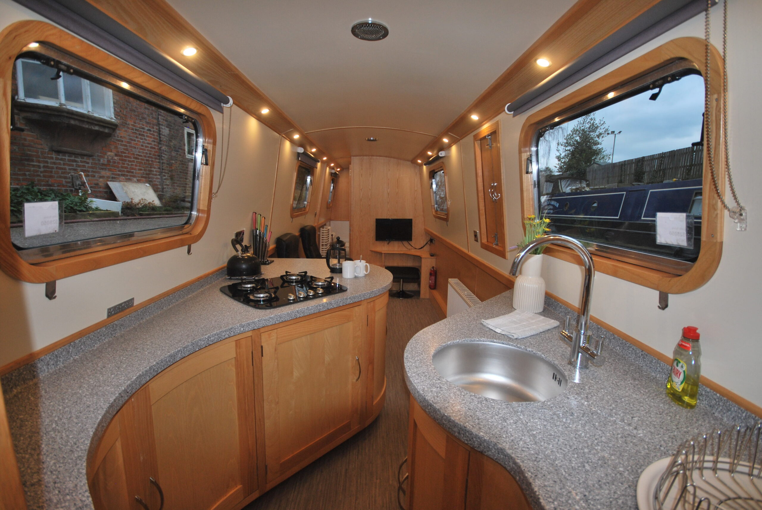 King size bed on a narrow canal boat