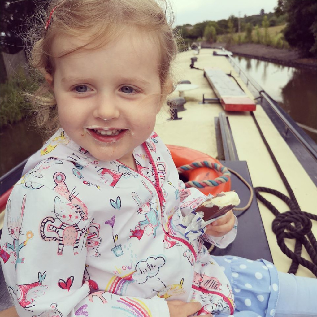 kid eating ice cream on a boat